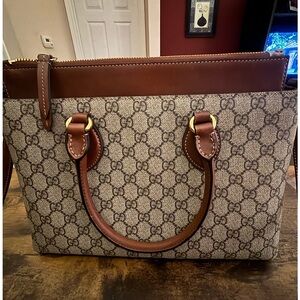 Gucci Tan and Brown Leather Interior.  Authentic. Comes with box and dust bag.